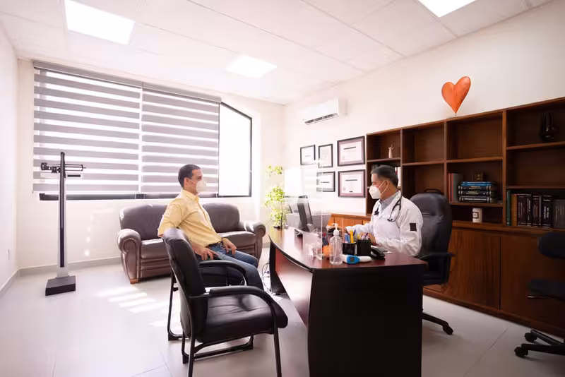 Hearing Assessment and Consultation Charges: A doctor in a clinic Doctor in clinic for Hearing Assessment and Consultation Charges - Hearing First Surbiton Price List And Fees