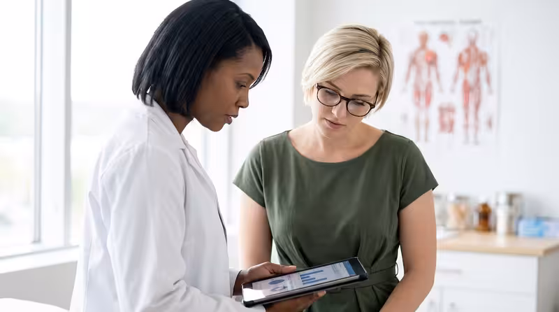 Comfort as Part of Independent Audiology Care: A doctor and patient during a consultation Doctor and patient consultation for Comfort as Part of Independent Audiology Care - Comfortable Waiting Areas At Hearing Fir...