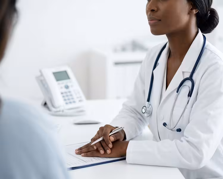How a Calm Reception Area Supports Better Hearing Care Outcomes: A doctor and patient during a consultation Doctor and patient consultation for How a Calm Reception Area Supports Better Hearing Care Outcomes - Comfortable Waiting Ar...